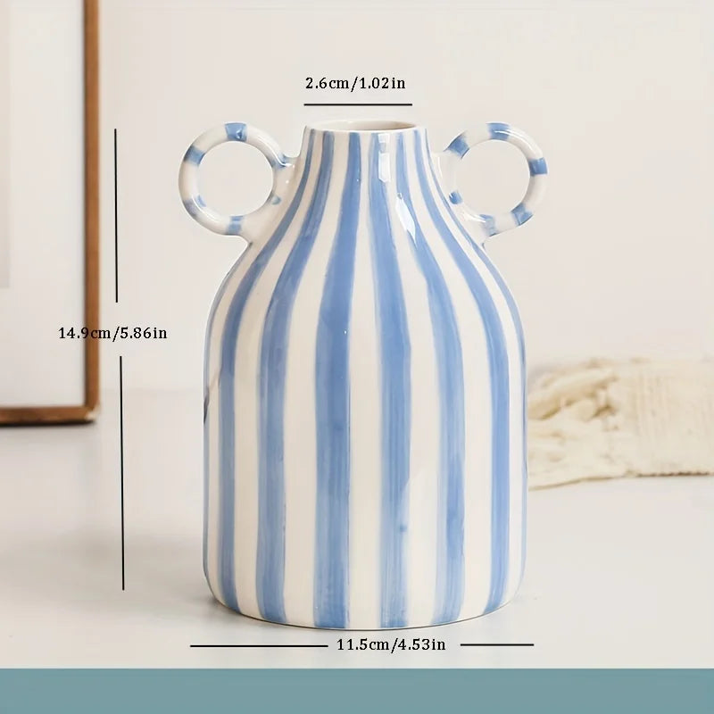 Blue and white striped vase with circular handles, shown with measurements on a light background.
