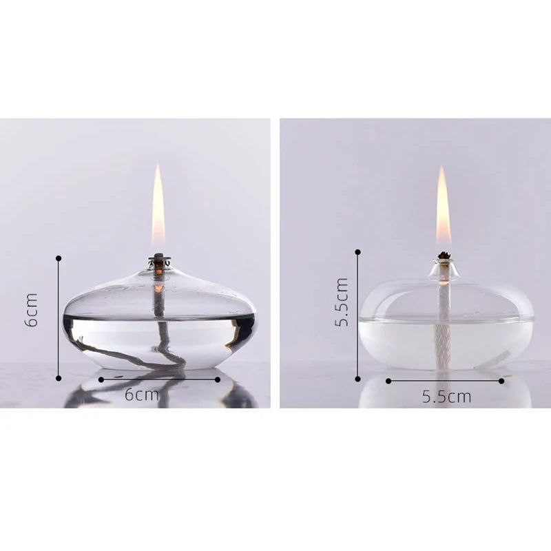 Two views of a clear glass oil lamp with measurements on a white background