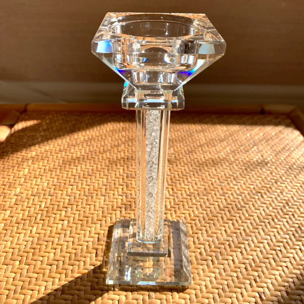 Clear glass candle holder on a woven surface