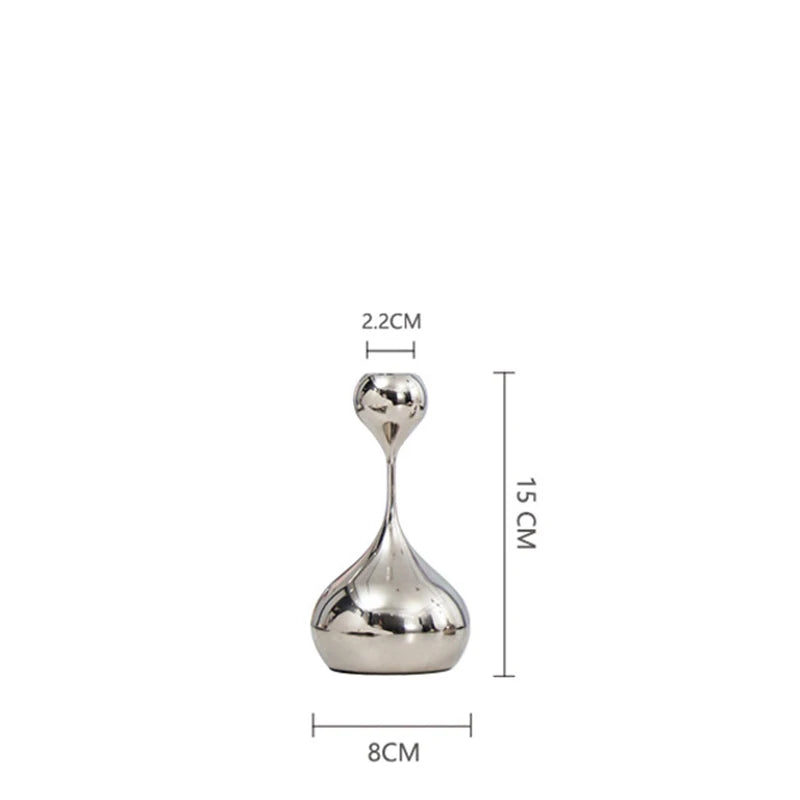 Small silver candle holder with dimensions on a white background