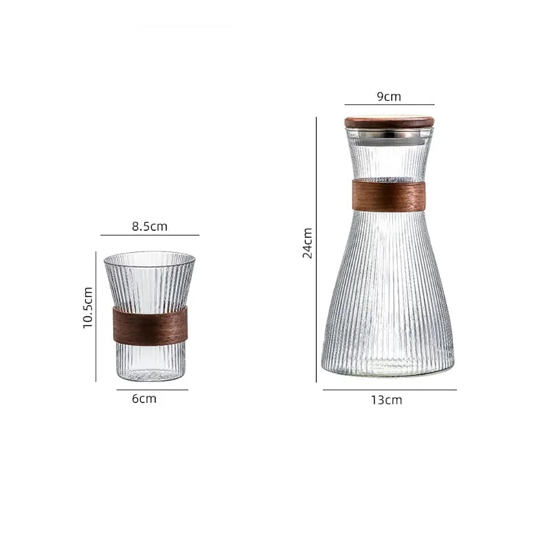 Glass carafe with wooden band and measurement details on a white background