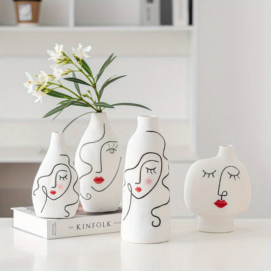 Set of white vases with face designs on a white surface
