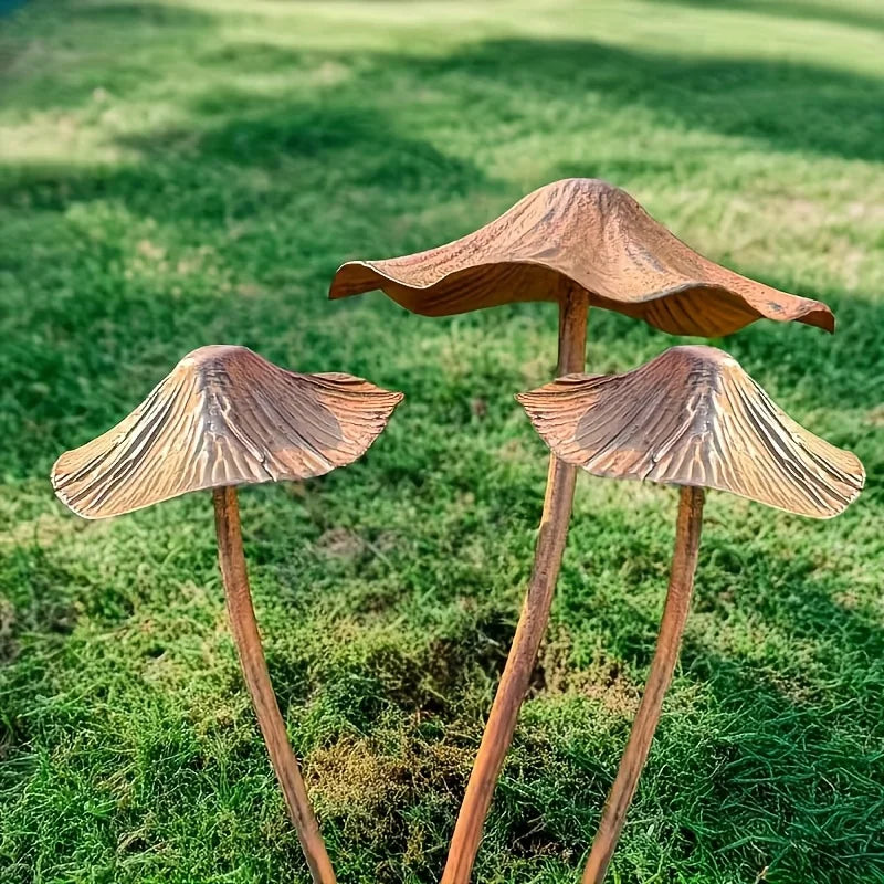Wooden mushroom sculptures on a grassy field
