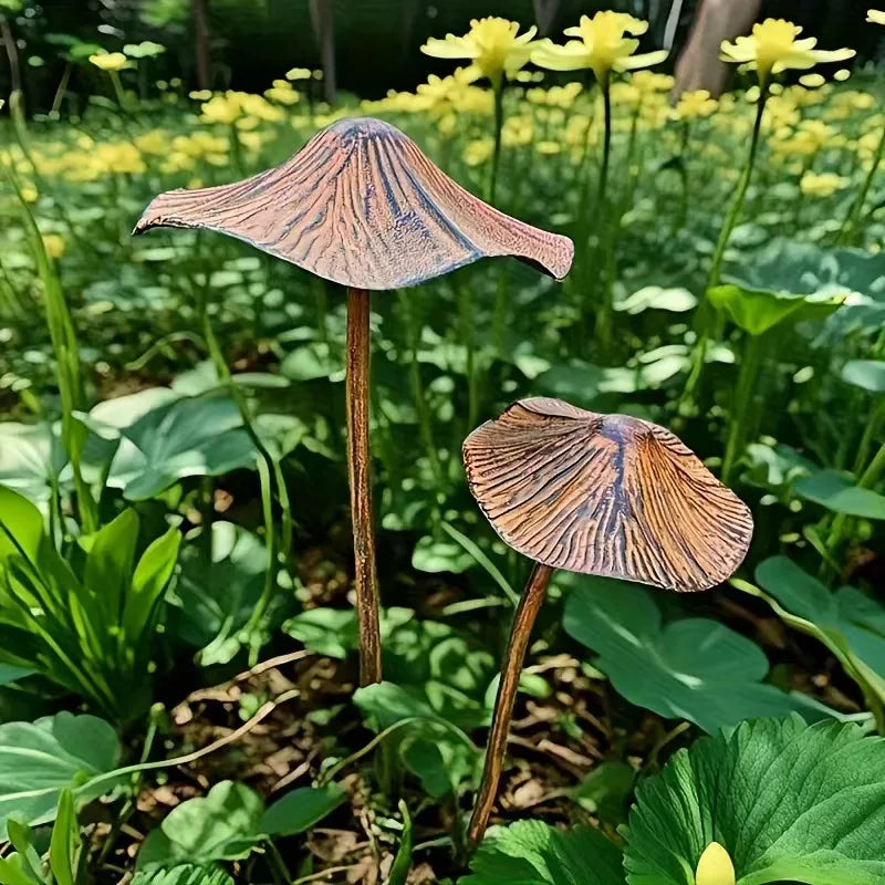 Two mushrooms with unique brown and blue cap patterns in a green forest setting.