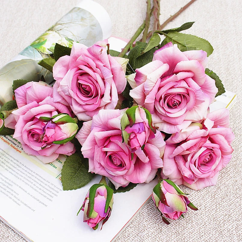 Bouquet of pink roses on a textured surface