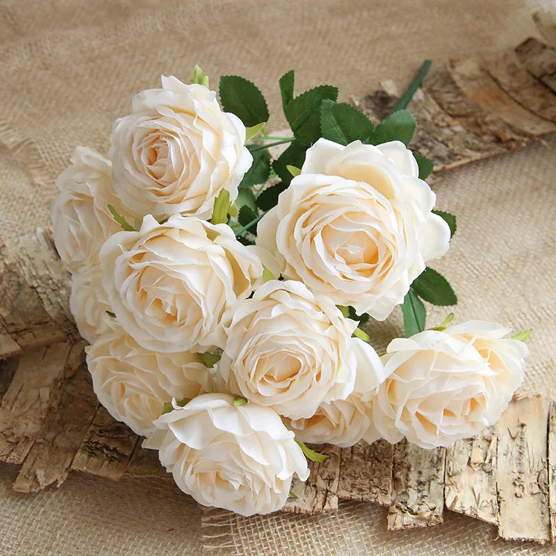 Bouquet of champagne roses on a rustic wooden surface