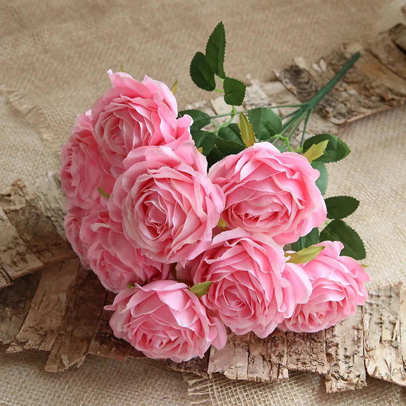 Bouquet of deep pink roses on a textured beige background