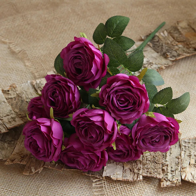 Bouquet of purple roses on a rustic wooden surface