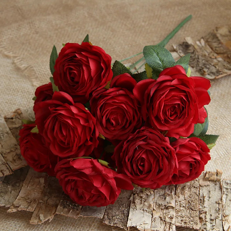 Bouquet of red roses on a textured surface