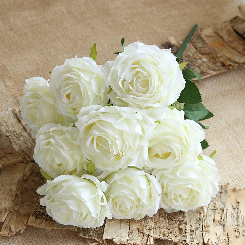 Bouquet of white roses on a rustic wooden surface