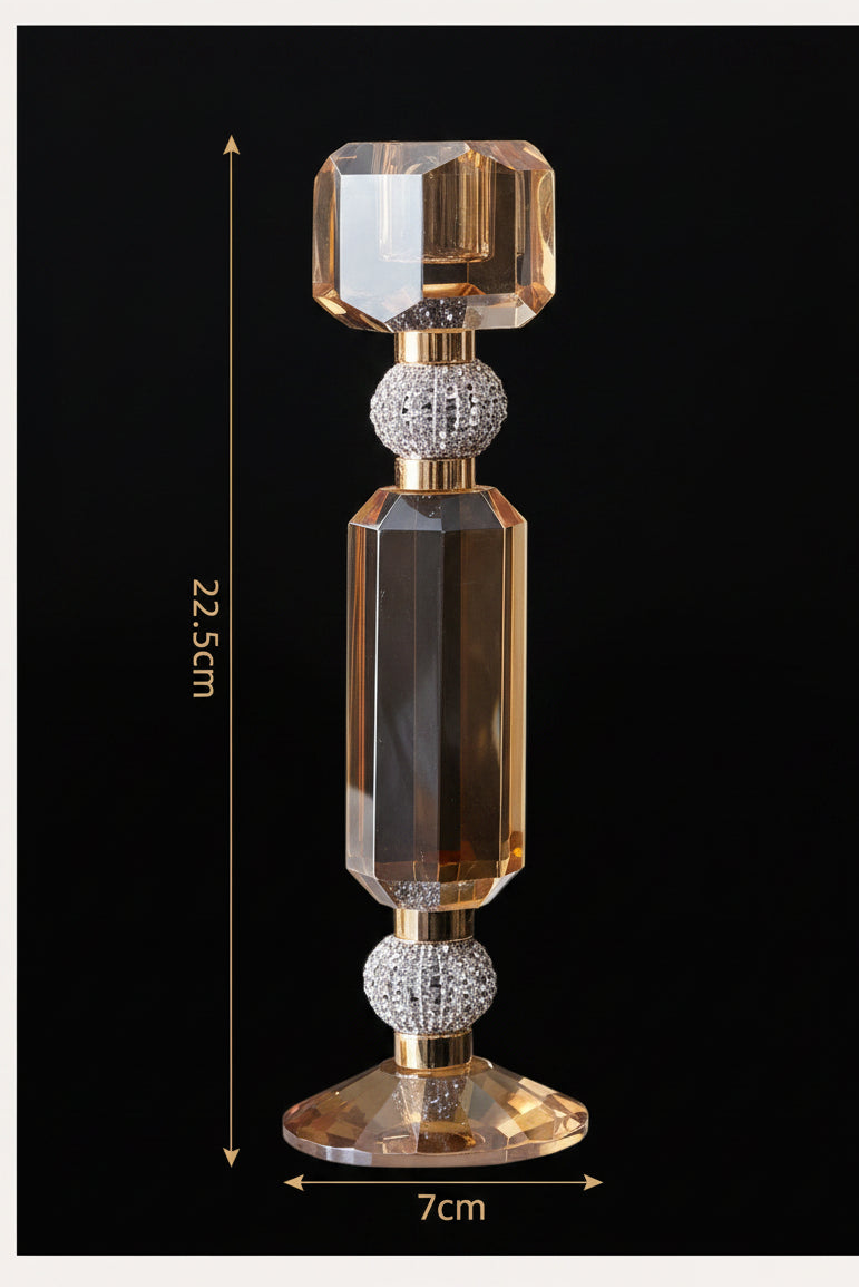 A faceted amber glass or crystal decorative object with gold-toned metal detailing and rhinestone-like white accents, shown on a light beige background with dimension lines indicating 22.5 cm height and 7 cm width.