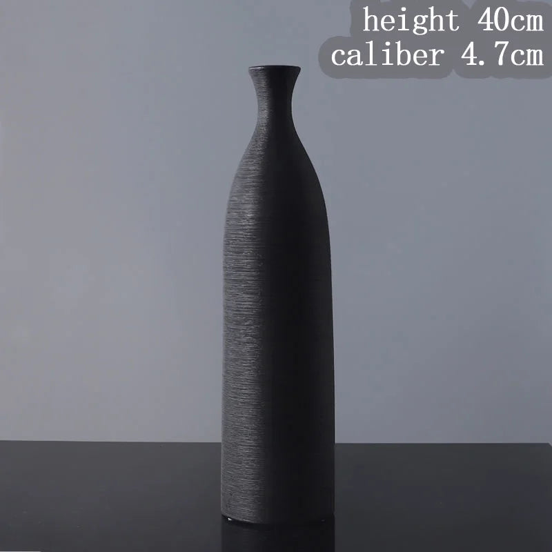 Black textured vase on a gray background with measurements displayed.