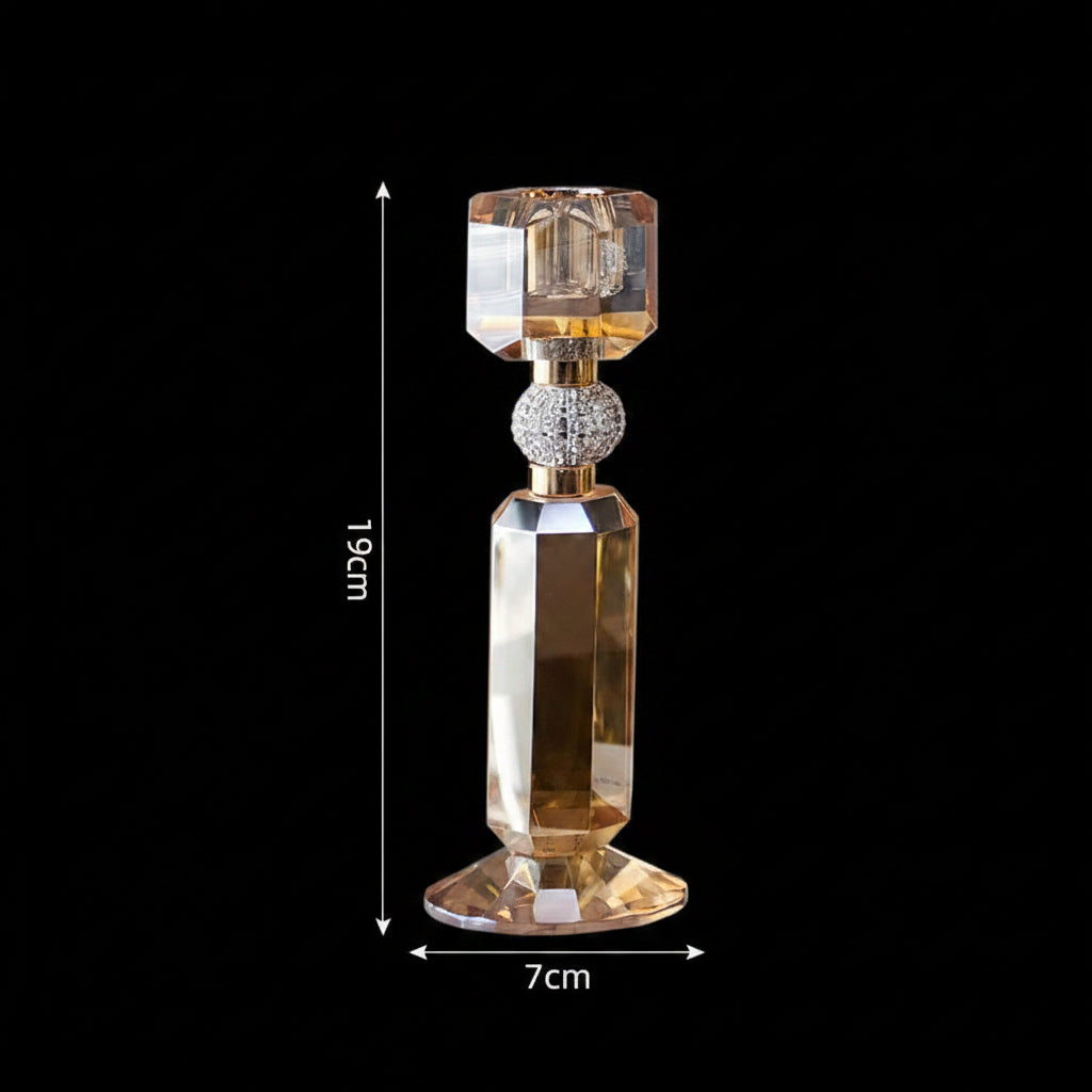 A faceted crystal candlestick holder with a gold-toned metal base and stem, shown with dimension markers indicating a height of 19cm and a base width of 7cm on a light beige background.